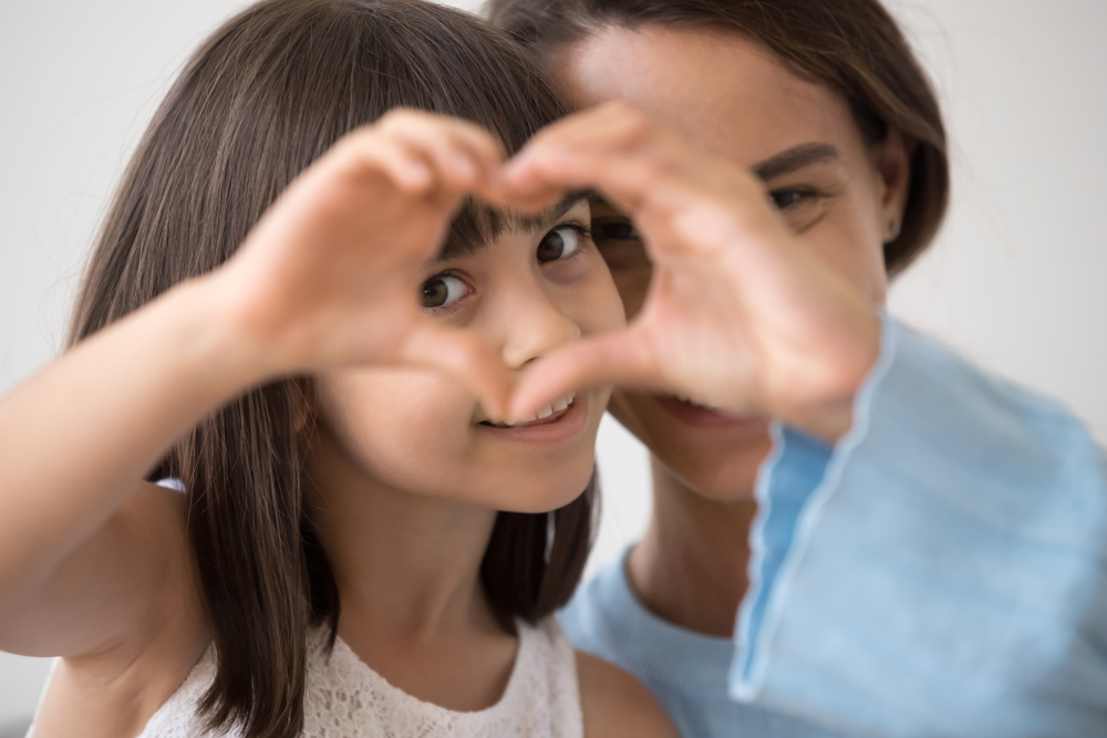 A mother and daughter share a moment highlighting the importance of early detection and specialized care for corneal conditions such as keratoconus through customized scleral lens solutions - Keratoconus/Scleral Lenses